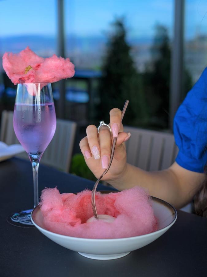 Hotel Hyatt Regency Sofia Esterno foto Cotton candy being eaten with a stick